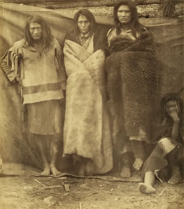 Framed Print : Group of Native Americans, three standing, one seated on the ground, possibly... 1860 or 1861. Creator: Unknown Framed Print : Group of Native Americans, three standing, one seated on the ground, possibly... 1860 or 1861. Creator: Unknown