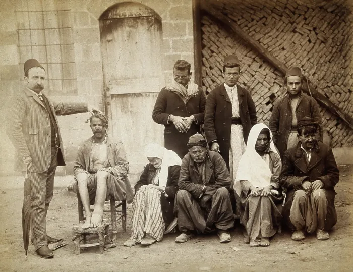 Framed Print : A group of people with leprosy in Jerusalem: a man in a striped suit... c1890s. Creator: Unknown Framed Print : A group of people with leprosy in Jerusalem: a man in a striped suit... c1890s. Creator: Unknown