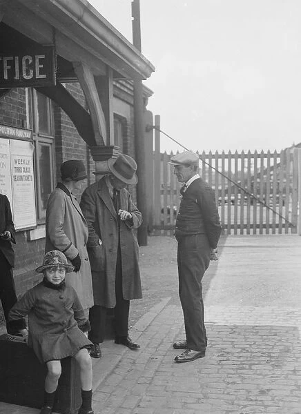 Group of people outside a Metropolitan Line railway station, London, 1930s. Artist: Bill Brunell