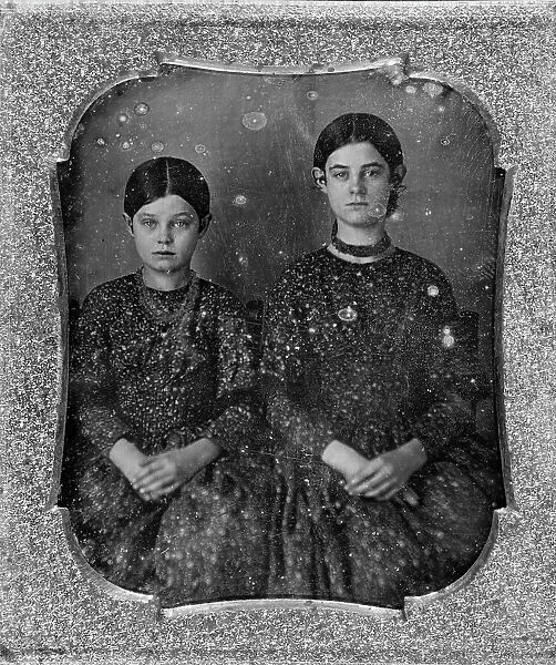 Group portrait of two unidentified girls, three-quarter length, seated, facing front, c1840 - 1860. Creator: Unknown