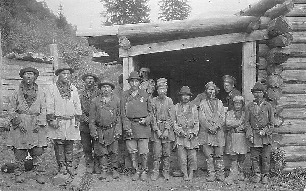 Group of Shoria Men with Village Headmen by a House, 1913. Creator: GI Ivanov