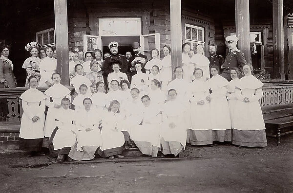 A group of students from the Maiden Institute with teachers on the porch of the dacha, 1900. Creators: I. A. Podgorbunskii, V. I. Podgorbunskii