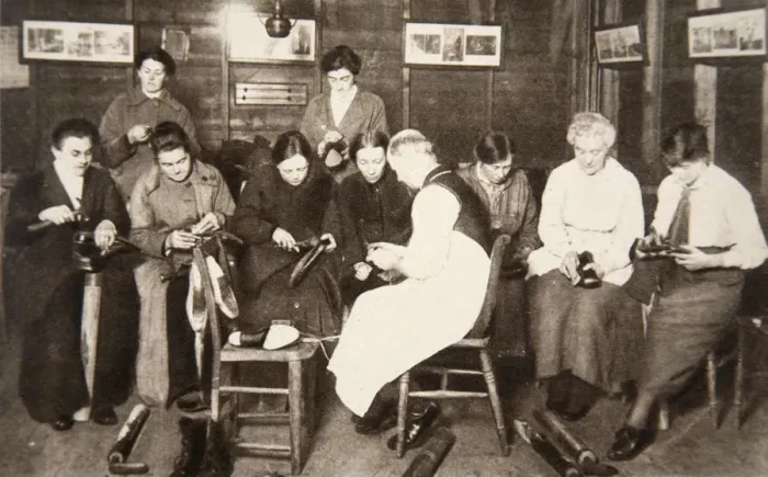 Framed Print : A group of women receive a lesson in boot repairing, World War I, c1914-c1918. Artist Framed Print : A group of women receive a lesson in boot repairing, World War I, c1914-c1918. Artist