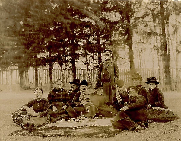 G.V. Iudina's Family with Their Guests in the Garden at the Dacha in Tarakanovo, 1907. Creator: Unknown