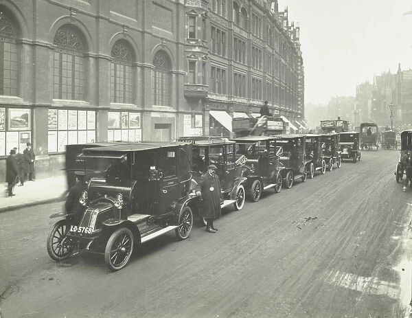 Hackney carriages and drivers at a taxi rank, Bishopsgate, London, 1912