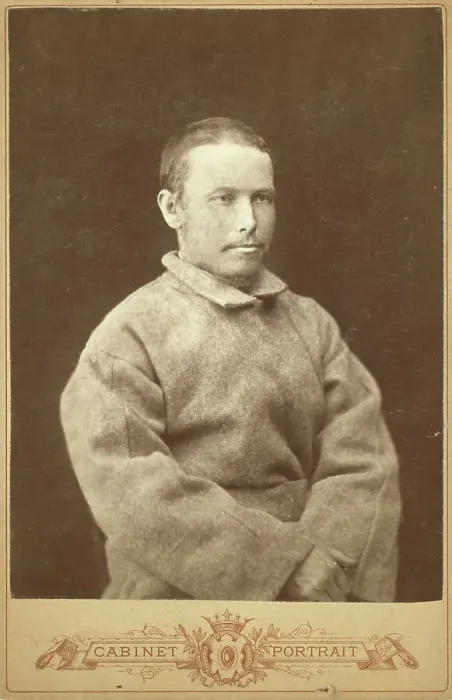 Framed Print : Half-length portrait of a man in convict coat, seated, facing right, between 1880 and 1886. Creator: Unknown Framed Print : Half-length portrait of a man in convict coat, seated, facing right, between 1880 and 1886. Creator: Unknown