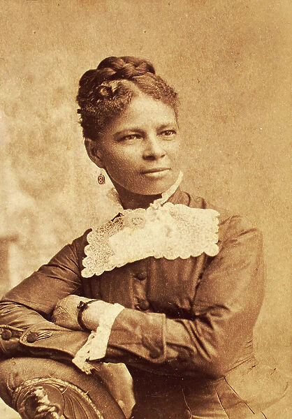 Half--length portrait of unidentified woman wearing wide lace collar, c1880-c1889. Creator: Richmond Photograph Co
