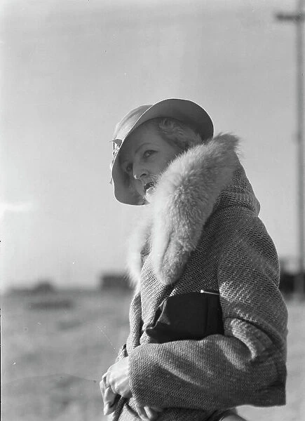 Hamilton, Esther, standing outdoors, 1933 May. Creator: Arnold Genthe