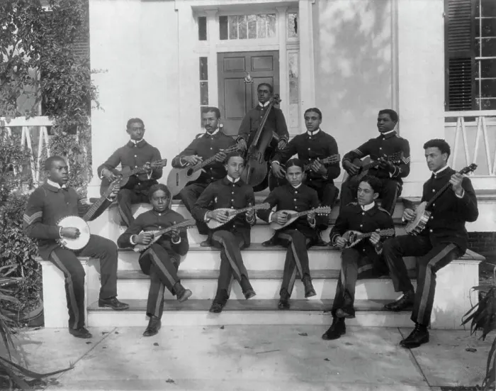 Framed Print : Hampton Institute, Hampton, Va. ca. 1898 - 11 students in uniform playing guitars... 1899 or 1900. Creator: Frances Benjamin Johnston Framed Print : Hampton Institute, Hampton, Va. ca. 1898 - 11 students in uniform playing guitars... 1899 or 1900. Creator: Frances Benjamin Johnston