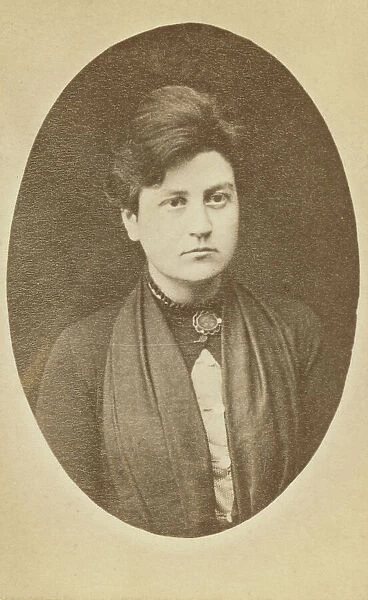 Head-and-shoulders portrait of woman, facing slightly right, between 1880 and 1886. Creator: Unknown