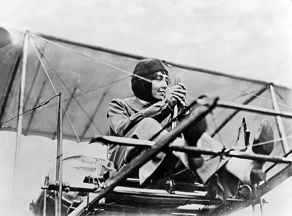 Helene Dutrieu at the controls of her plane, c. 1911