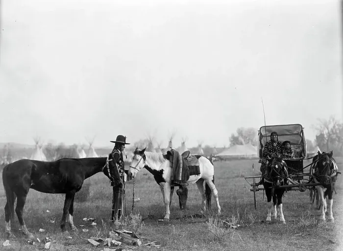 Framed Print : High Medicine Rock, Crow Indian with two horses at left, Her Horse Kills with child in... c1908. Creator: Edward Sheriff Curtis Framed Print : High Medicine Rock, Crow Indian with two horses at left, Her Horse Kills with child in... c1908. Creator: Edward Sheriff Curtis
