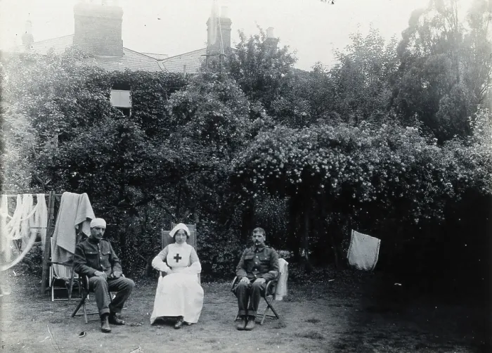 Framed Print : Holmleigh Auxiliary Military Hospital, Harrow: a nurse and two soldiers, one of whom has... c1922. Creator: Unknown Framed Print : Holmleigh Auxiliary Military Hospital, Harrow: a nurse and two soldiers, one of whom has... c1922. Creator: Unknown