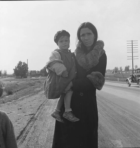 Homeless mother and youngest child of seven... on U.S. 99, near Brawley, Imperial County, 1939. Creator: Dorothea Lange