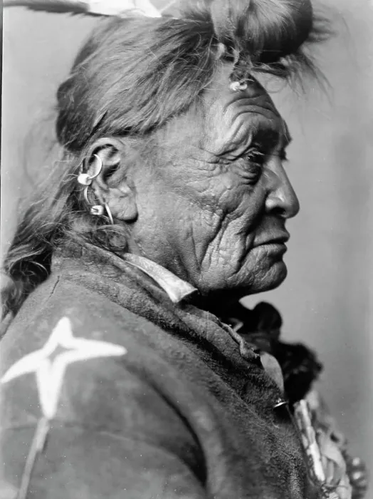 Framed Print : Hoop On the Forehead, Crow Indian, Montana, head-and-shoulders portrait, facing right, c1908. Creator: Edward Sheriff Curtis Framed Print : Hoop On the Forehead, Crow Indian, Montana, head-and-shoulders portrait, facing right, c1908. Creator: Edward Sheriff Curtis