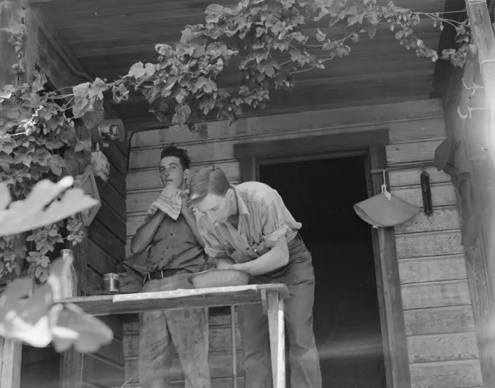 Framed Print : Hop farmers sons, washing for noon meal on back porch, Independence, Polk County, Oregon, 1939. Creator: Dorothea Lange Framed Print : Hop farmers sons, washing for noon meal on back porch, Independence, Polk County, Oregon, 1939. Creator: Dorothea Lange