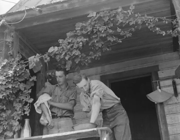 Framed Print : Hop farmers sons, washing for noon meal on back porch, Independence, Polk County, Oregon, 1939. Creator: Dorothea Lange Framed Print : Hop farmers sons, washing for noon meal on back porch, Independence, Polk County, Oregon, 1939. Creator: Dorothea Lange