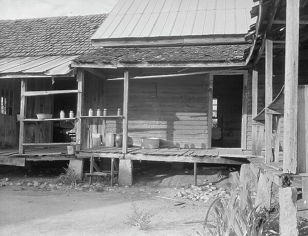 House in which cotton farmer has lived for fifty years, Macon County, Georgia, 1937. Creator: Dorothea Lange