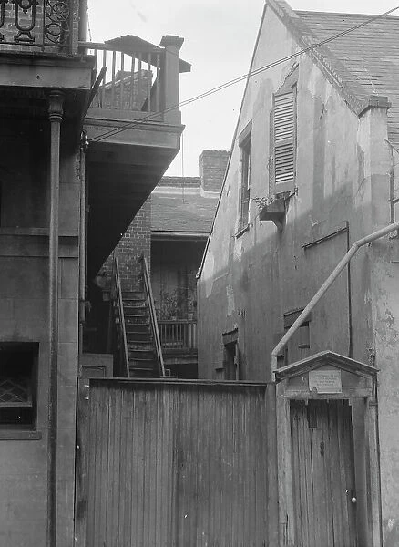 Houses in the French Quarter, New Orleans, between 1920 and 1926. Creator: Arnold Genthe
