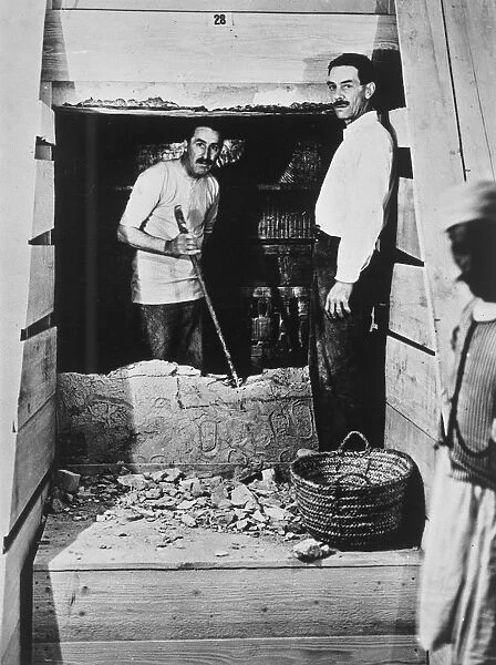 Howard Carter and a colleague excavating a tomb in the Valley of the Kings, Egypt, 1922