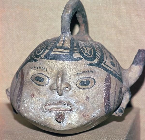 Huaxtec culture spouted jug painted with a human face
