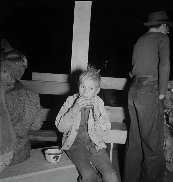 Framed Print : Hungry boy at the Halloween party for migrant workers, Shafter migrant camp, California, 1938. Creator: Dorothea Lange Framed Print : Hungry boy at the Halloween party for migrant workers, Shafter migrant camp, California, 1938. Creator: Dorothea Lange