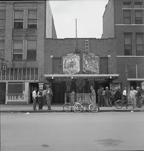 Idle men attend the morning movies, Oklahoma City, Oklahoma, 1937. Creator: Dorothea Lange