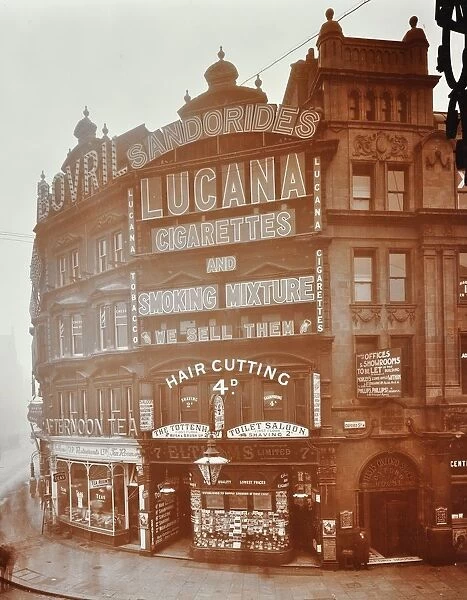 Illuminated advertisements on shop fronts at 7, Oxford Street, London, 1909