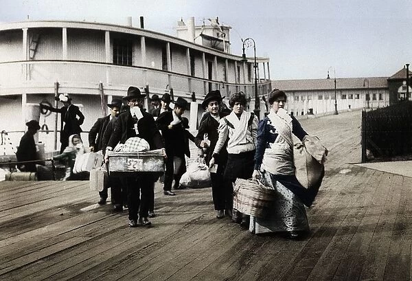 Immigrants to the USA landing at Ellis Island, New York, c1900