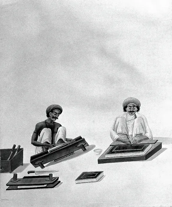 Framed Print : Two Indian bookbinders: one trimming page edges in a press, the other decorating a binding. Creator: Unknown