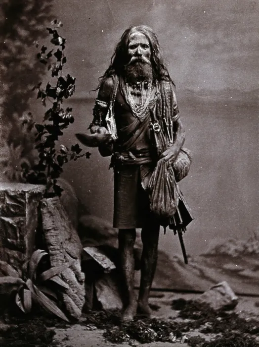 Framed Print : An Indian man wearing many beads, and carrying a begging bowl and an umbrella, in a... c1900. Creator: Unknown Framed Print : An Indian man wearing many beads, and carrying a begging bowl and an umbrella, in a... c1900. Creator: Unknown