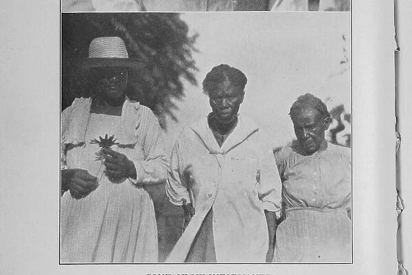 Some of my informants; [Note the 'mojo' around the neck of the center figure], 1926. Creator: Unknown. Some of my informants; [Note the 'mojo' around the neck of the center figure], 1926. Creator: Unknown