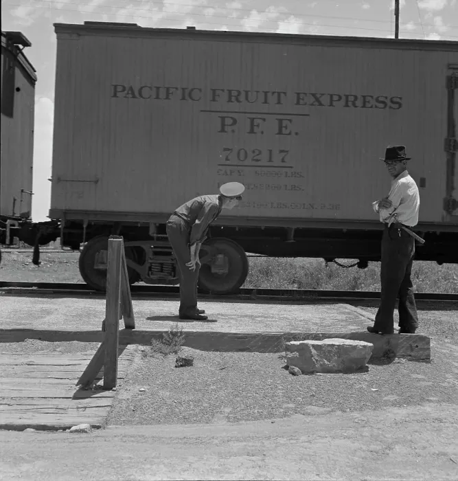 Framed Print : Inspecting a freight train from Mexico for smuggled immigrants, El Paso, Texas, 1938. Creator: Dorothea Lange Framed Print : Inspecting a freight train from Mexico for smuggled immigrants, El Paso, Texas, 1938. Creator: Dorothea Lange
