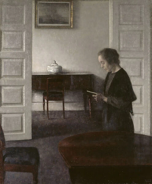 Interior with a Reading Lady, 1900. Creator: Vilhelm Hammershoi