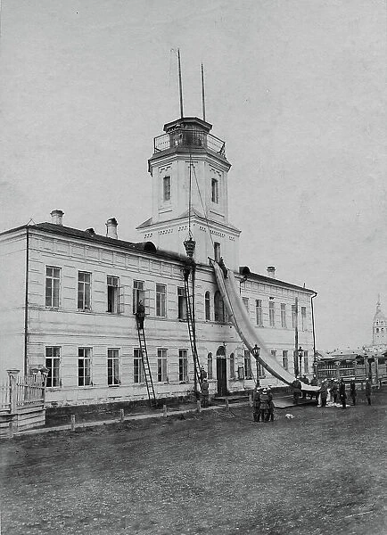 Irkutsk police fire brigade. Exercise with a rescue sheet and a rescue basket, 1894. Creator: R Prorokov