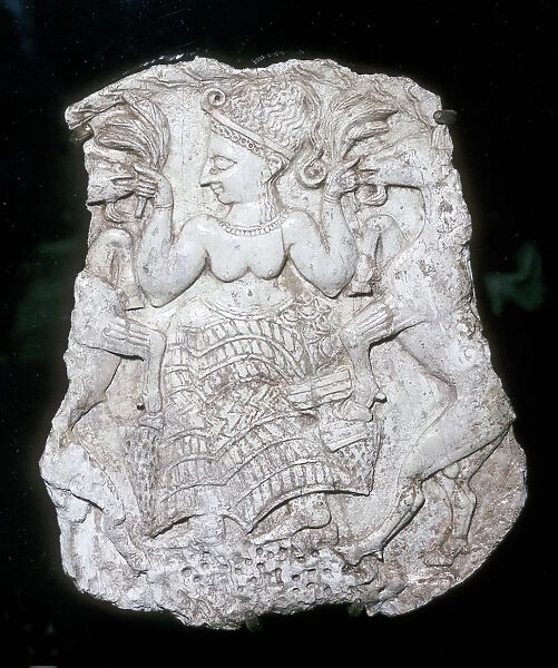 Ivory cosmetic box cover depicting a goddess feeding caprids, Tomb at Minet-el-Beida, c1250 BC