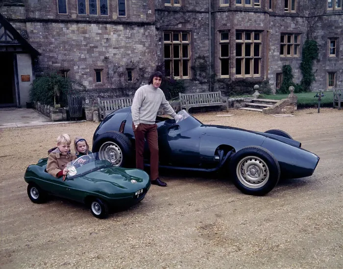 Framed Print : Jackie Stewart posing with a 1957 BRM Framed Print : Jackie Stewart posing with a 1957 BRM