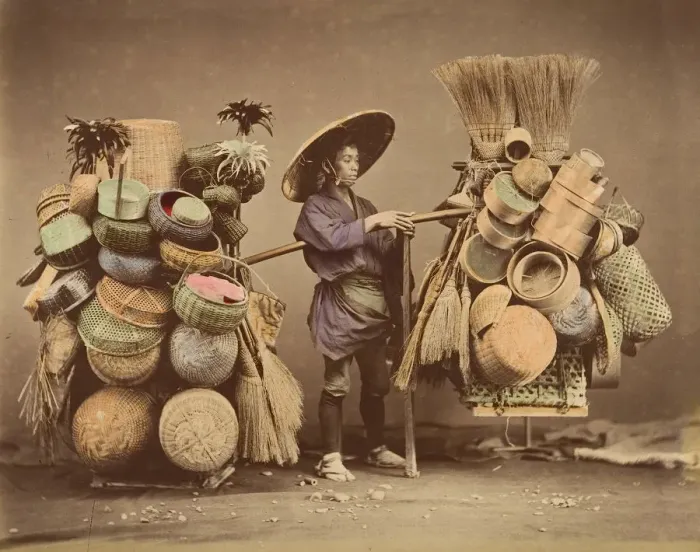 Framed Print : [Japanese Man Posing with Baskets, Brooms and Feather Dusters], 1870s. Creator: Unknown