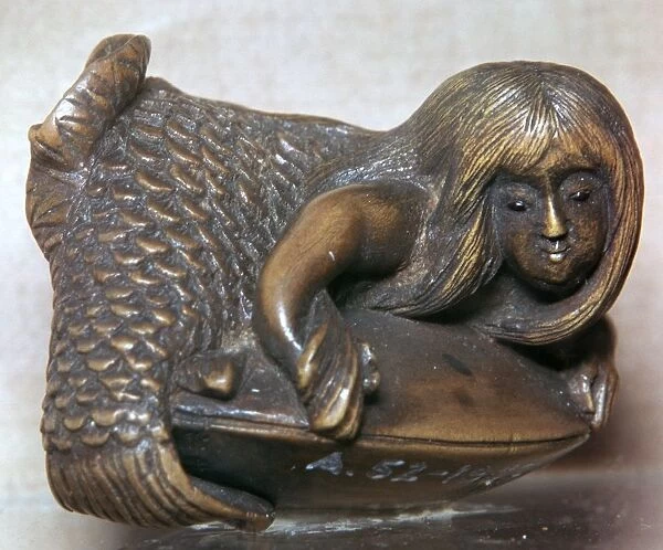 Japanese Netsuke of a mermaid on a clam, 18th century