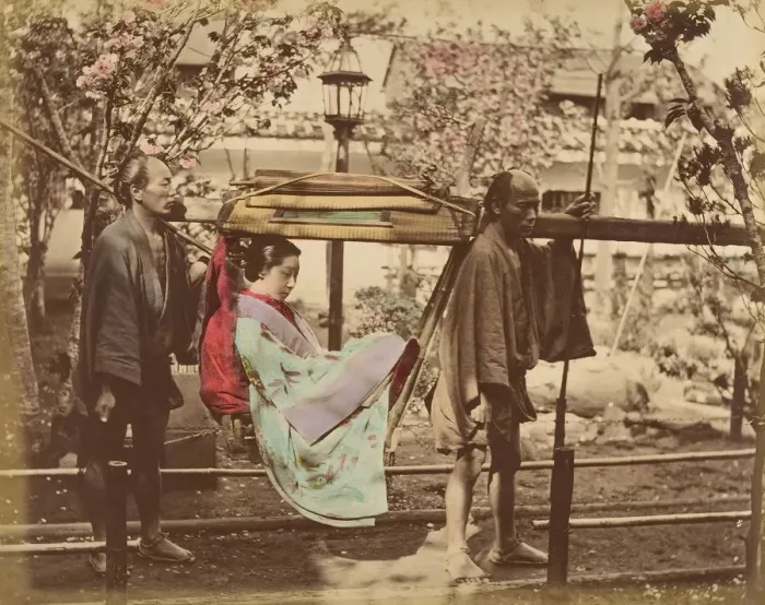 Framed Print : [Japanese Woman in a Chair Carried by Two Men], 1870s. Creator: Unknown