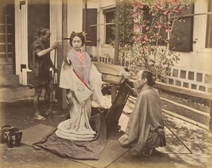 Framed Print : [Japanese Woman in Traditional Dress Posing with Two Men], 1870s. Creator: Unknown