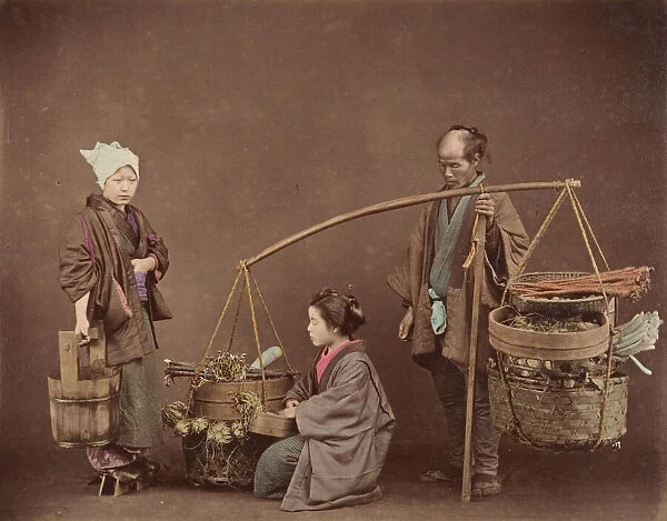 Two Japanese Women and One Japanese Man Posing with Water Bucket and Baskets], 1870s