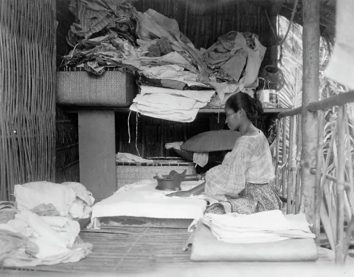 Framed Print : Javanese(?) woman sitting in room working with textiles at exhibit featuring foreign... 1892. Creator: Frances Benjamin Johnston Framed Print : Javanese(?) woman sitting in room working with textiles at exhibit featuring foreign... 1892. Creator: Frances Benjamin Johnston