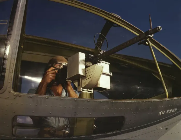 Framed Print : Jesse Rhodes Waller, A.O.M. third class, tries out a 30-calibre... Naval Air Base, Corpus... 1942. Creator: Howard Hollem