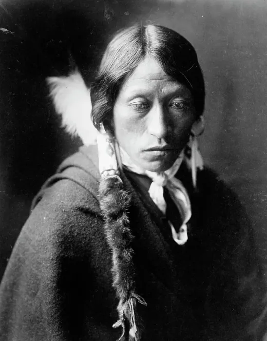 Framed Print : Jicarilla man, head-and-shoulders portrait, facing slightly right, with fur wrapped braids... c1905 Creator: Edward Sheriff Curtis Framed Print : Jicarilla man, head-and-shoulders portrait, facing slightly right, with fur wrapped braids... c1905 Creator: Edward Sheriff Curtis