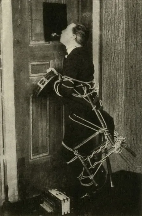 Framed Print : John Nevil Maskelyne performs a spirit cabinet illusion, c1910. Creator: Unknown Framed Print : John Nevil Maskelyne performs a spirit cabinet illusion, c1910. Creator: Unknown