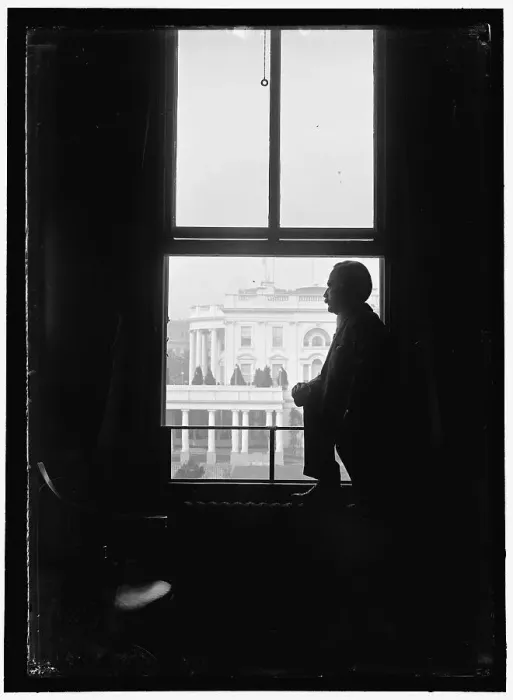 Framed Print : John Skelton Williams at window with White House visible in background... between 1913 and 1918. Creator: Harris & Ewing. John Skelton Williams at window with White House visible in background... between 1913 and 1918. Creator: Harris & Ewing Framed Print : John Skelton Williams at window with White House visible in background... between 1913 and 1918. Creator: Harris & Ewing. John Skelton Williams at window with White House visible in background... between 1913 and 1918. Creator: Harris & Ewing
