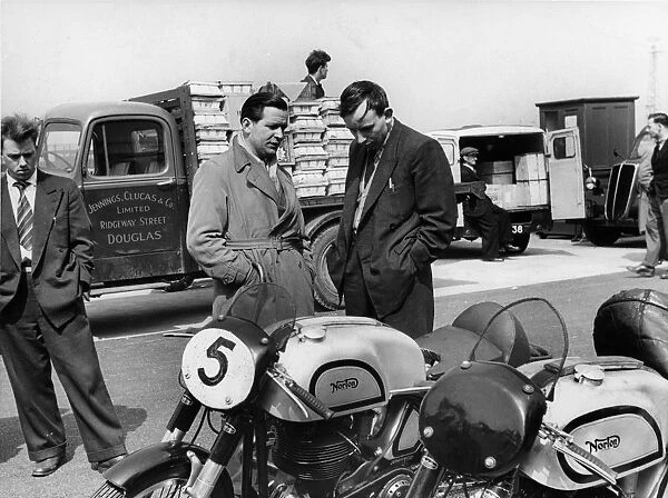 John Surtees with Nortons in paddock at 1954 Isle of Man T. T Creator: Unknown