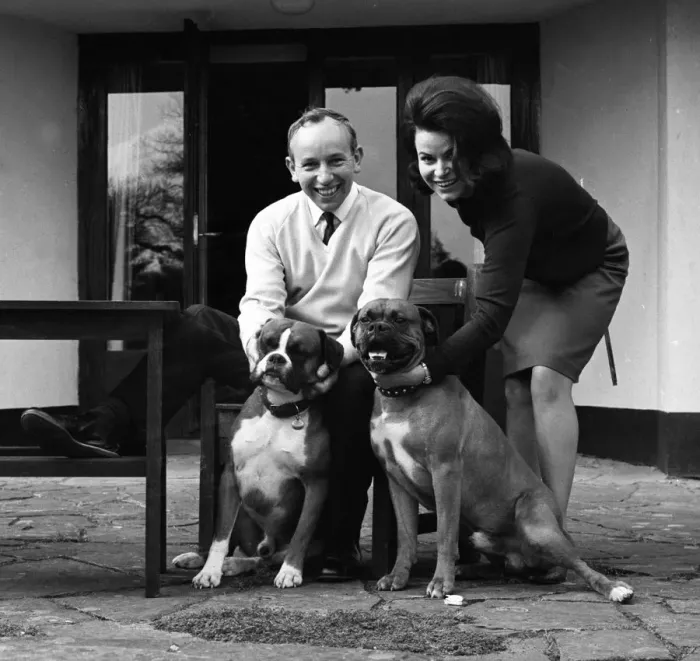 Framed Print : John Surtees relaxes at home with his wife and pet dogs in 1966. Creator: Unknown Framed Print : John Surtees relaxes at home with his wife and pet dogs in 1966. Creator: Unknown