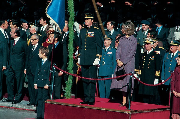 Juan Carlos I, King of Spain, with Queen Sofia and Prince Felipe, presiding over